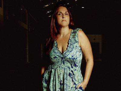 beautiful-model-posing-in-sexy-dress-at-black-studio